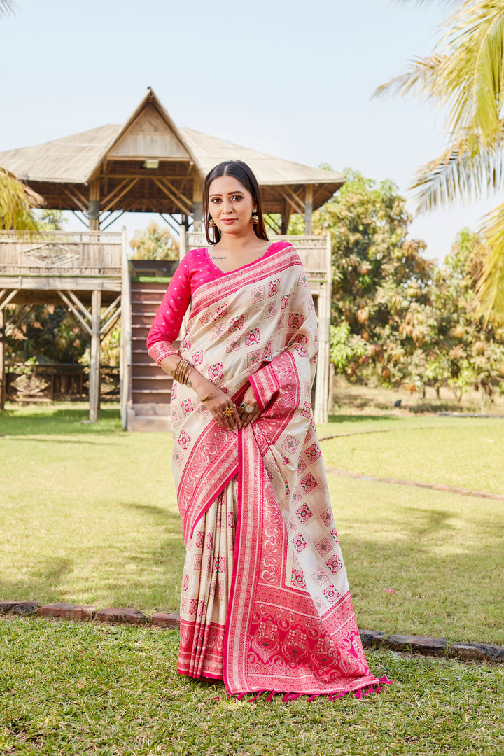 Elegant pink Kanjivaram soft silk saree with detailed designer borders and soft sheen.