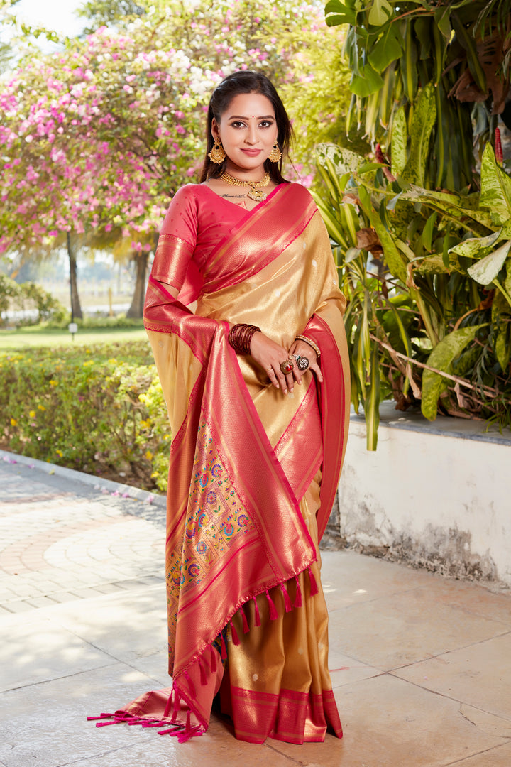 Stunning beige tissue silk saree with intricate pallu and contrast blouse, perfect for traditional ceremonies.