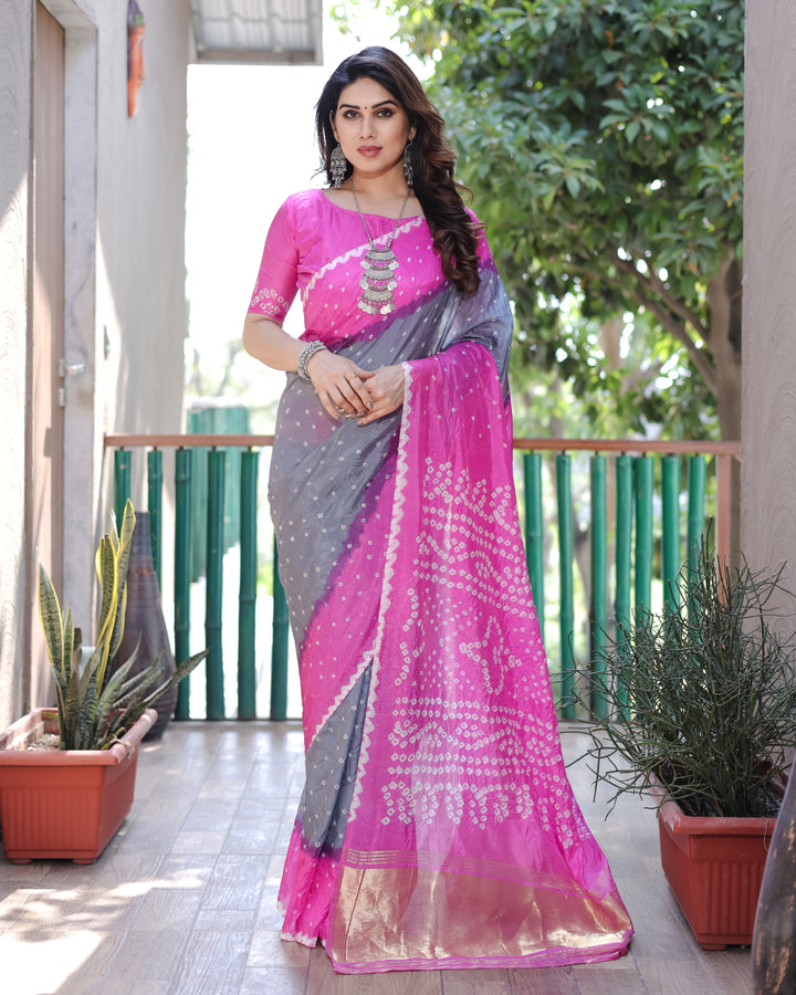 Add glamour with Hot-Pink Bandhej Silk Drapes with a Zari Tissue Pallu and elegant blouse piece.