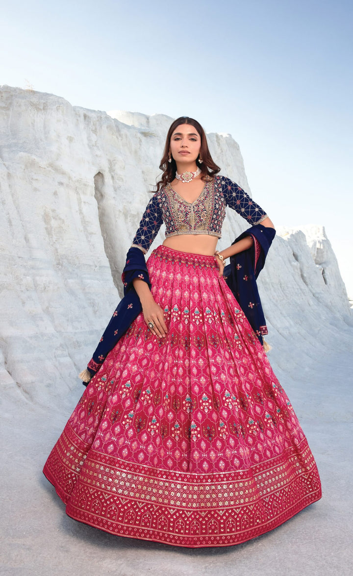 Traditional navy blue and deep pink lehenga set, perfect for weddings, featuring elegant detailing and cultural style.