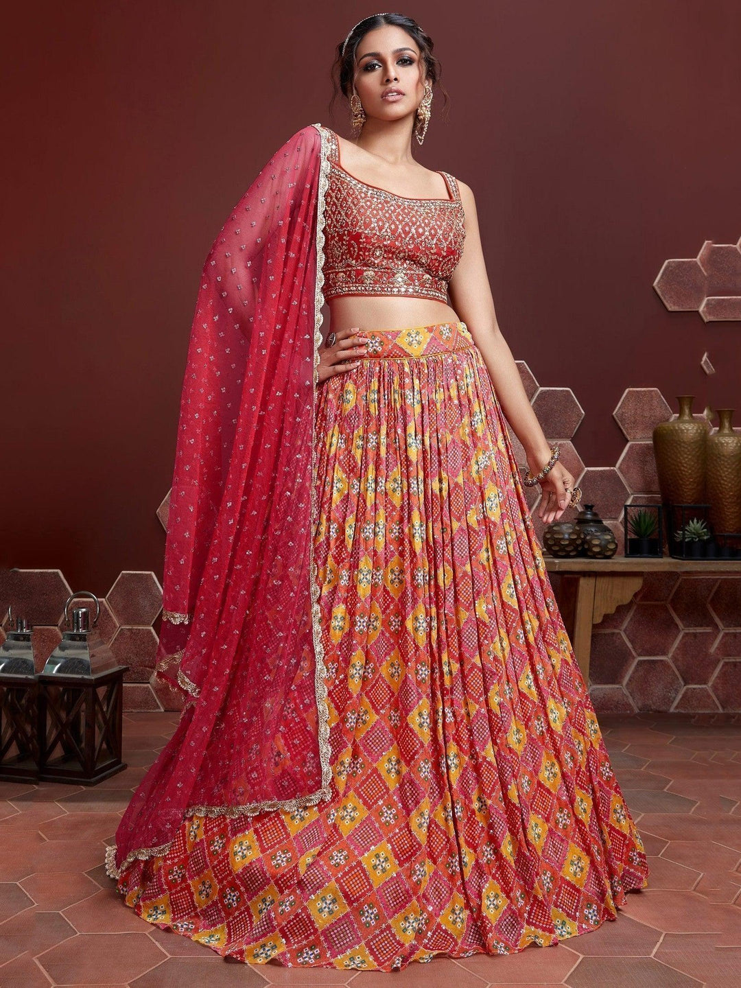 Red sequins embroidered chinon silk lehenga choli with matching dupatta.