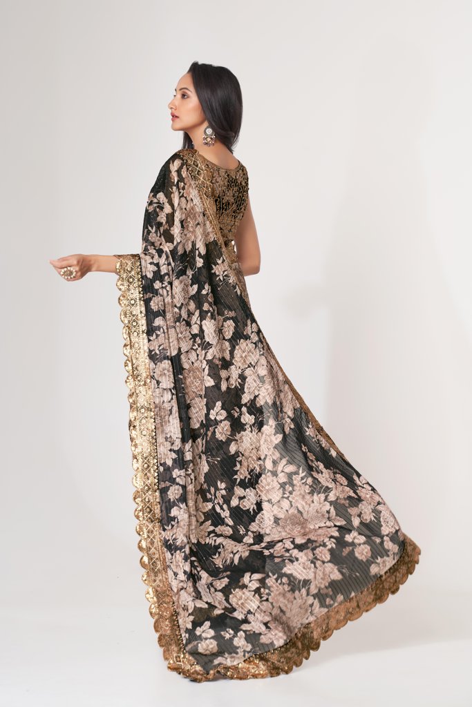 Classic navy floral print saree with sequin embroidery details, perfect for festive wear.