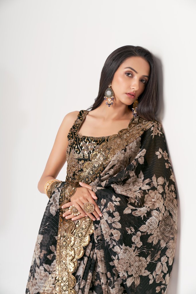 Navy floral print organza saree with delicate sequin embroidery for a modern, traditional look.