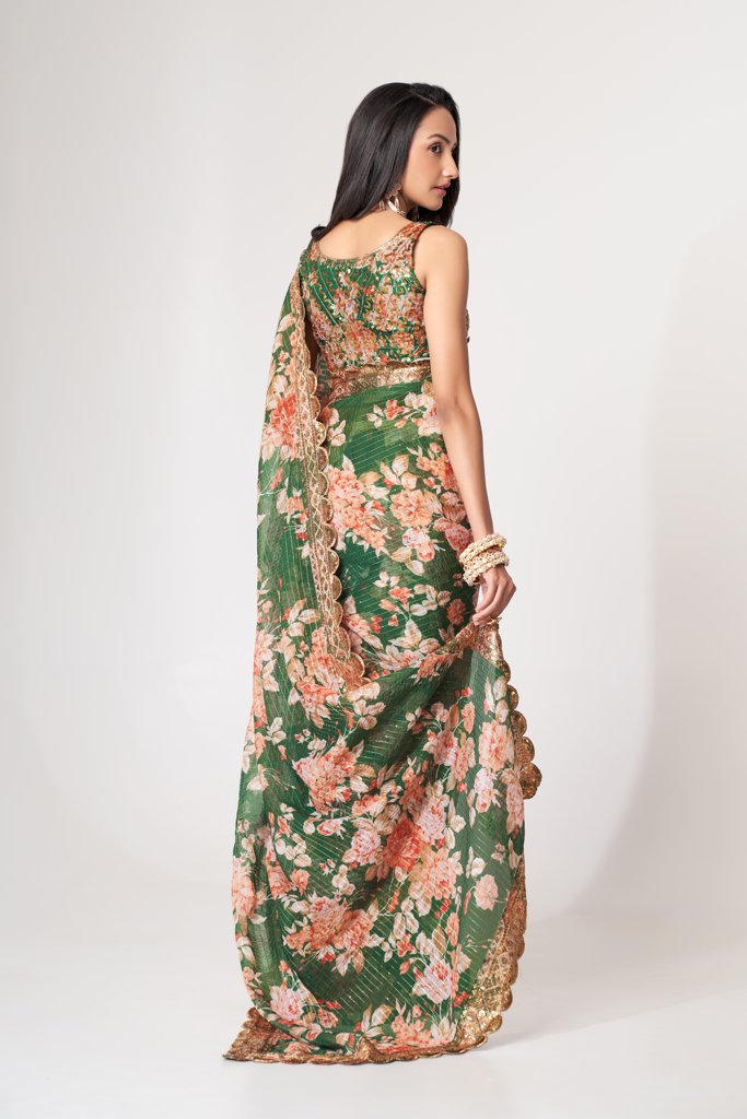 Graceful red floral print saree in organza with delicate sequin embroidery for festive elegance.