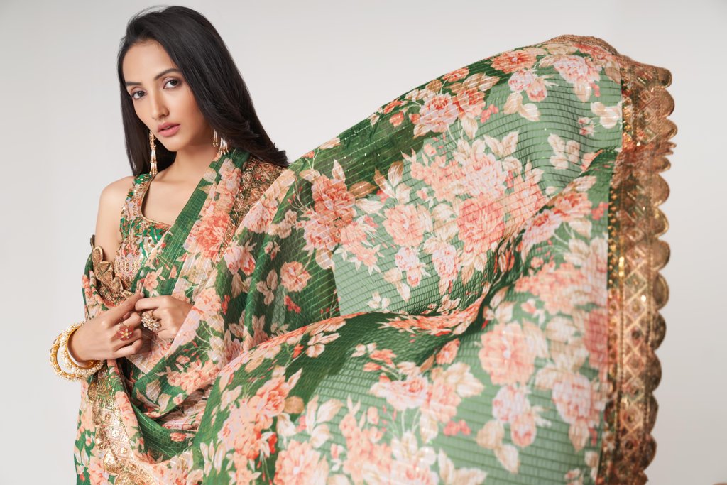 Elegant red floral print saree in organza with intricate sequin embroidery for cultural celebrations.