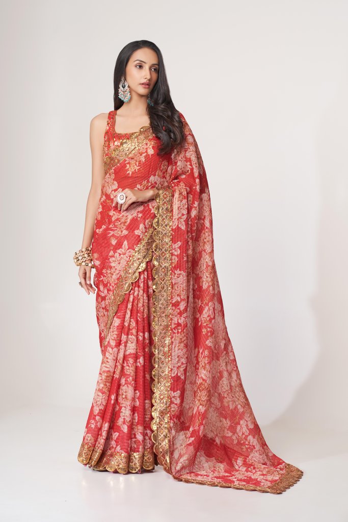 Elegant sky-blue floral print saree in organza with sequin embroidery for evening functions.