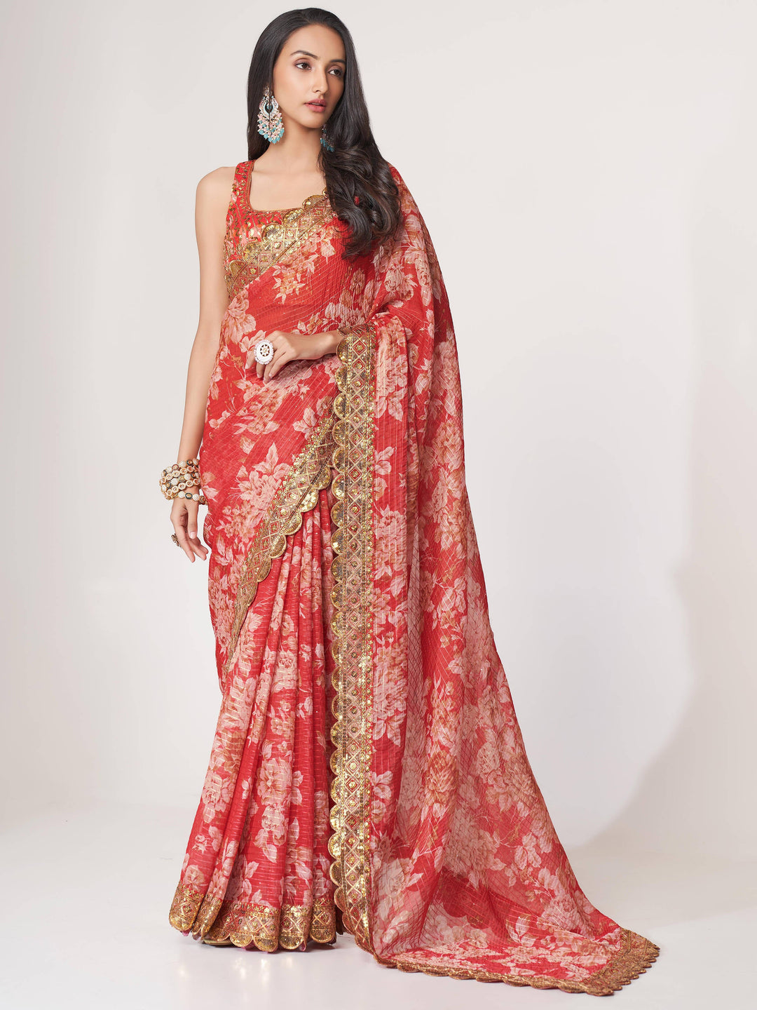 Red luxurious fabric saree crafted for elegance and style.