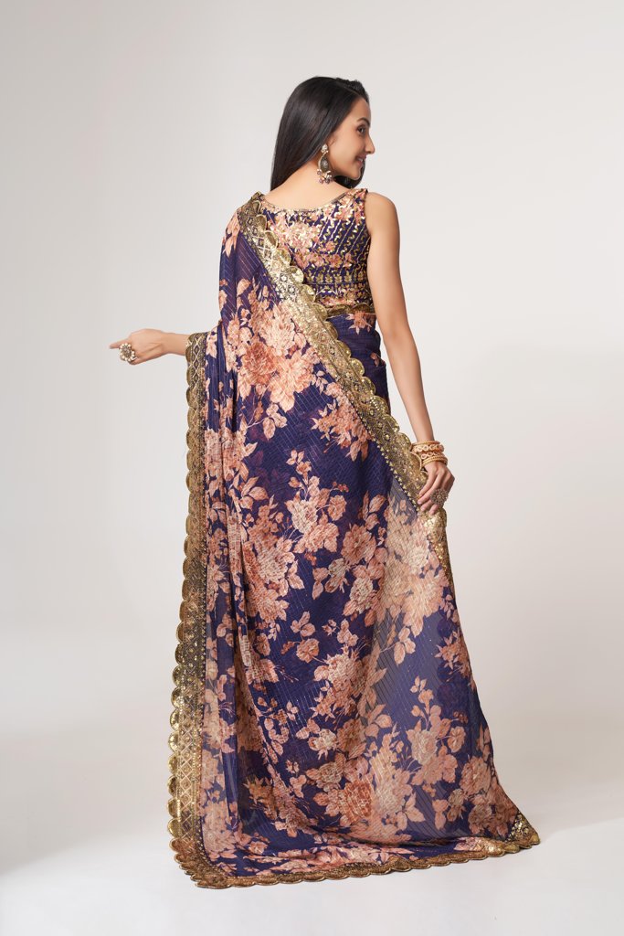 Timeless sky-blue floral print saree with intricate sequin embroidery, ideal for evening wear.