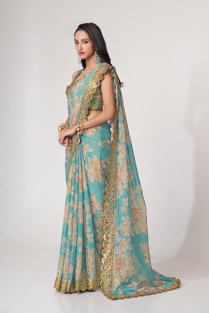 Vibrant green floral print saree with delicate sequin embroidery for festive wear.