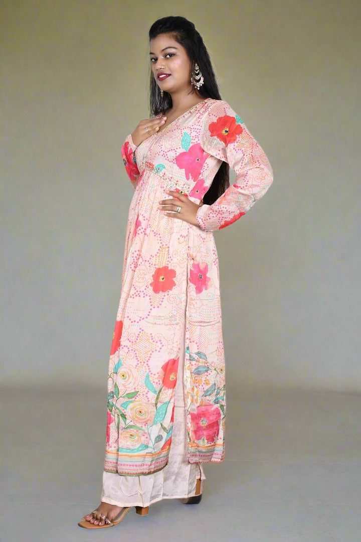 Women’s elegant light peach palazzo set featuring a trendy floral print kurti, ideal for cultural celebrations and gatherings.