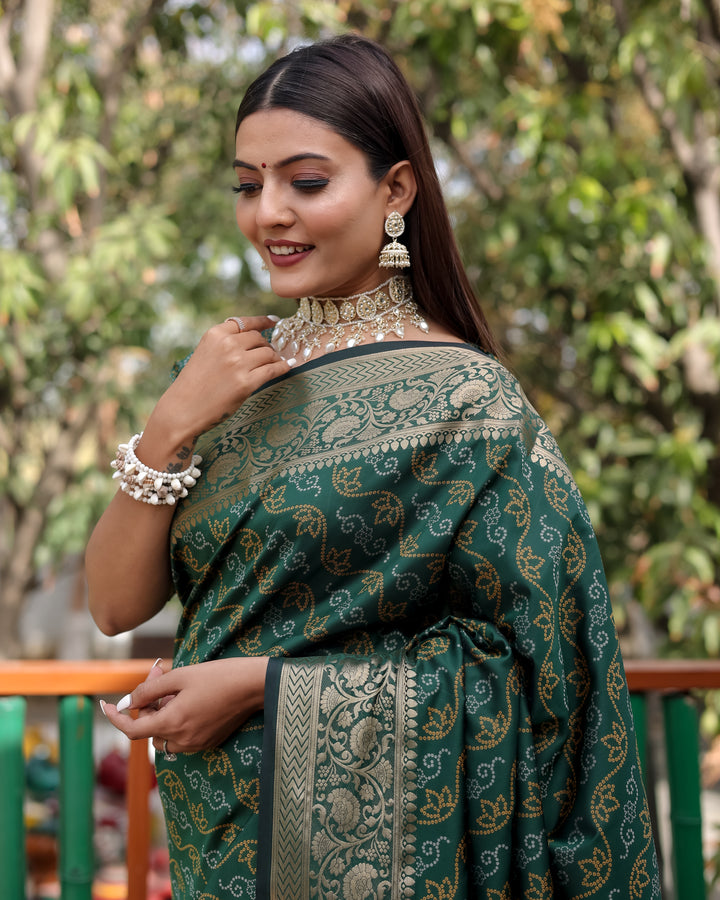 Gorgeous green Bandhej Patola silk saree with intricate zari work and traditional Kanchi borders, perfect for celebrations.