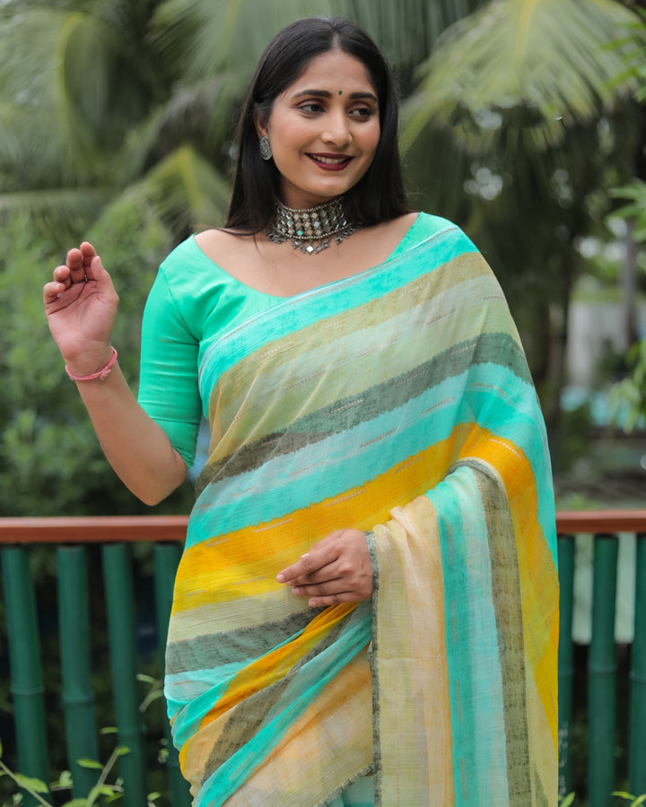 This deep mint Moss chiffon saree features a soft and elegant design with all-over prints and shimmering gold accents, ideal for weddings.