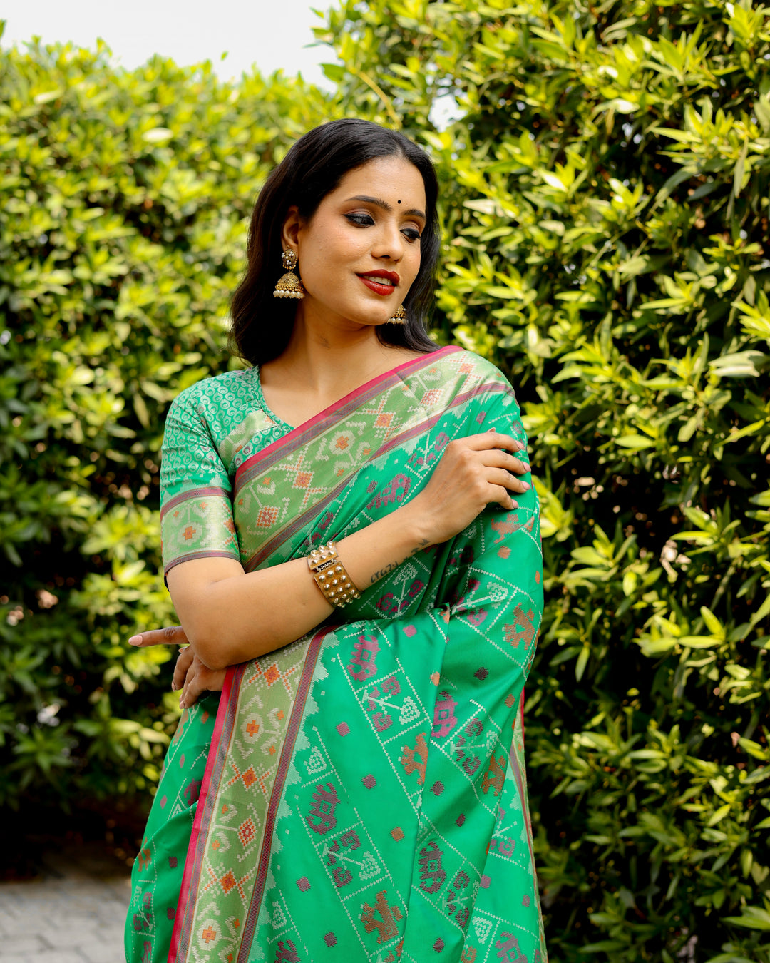 Gorgeous orange Bandhej silk saree with matching blouse and zari pallu, perfect for luxury events.