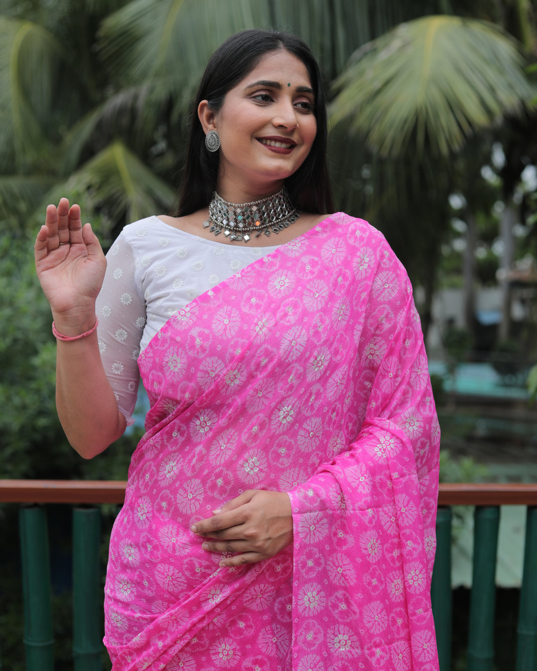 Gorgeous pink chiffon saree with delicate foil detailing, perfect for weddings and celebrations.