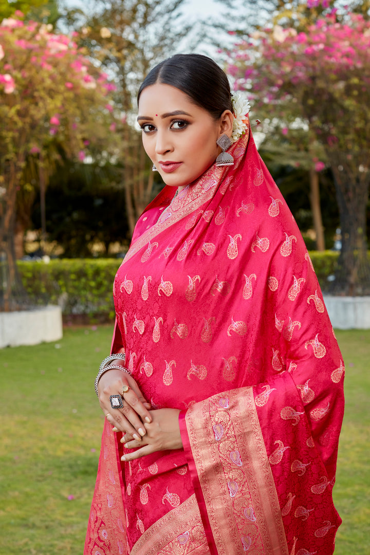 Vibrant red Kanjivaram satin silk saree with intricate butta design and woven pallu, ideal for weddings.