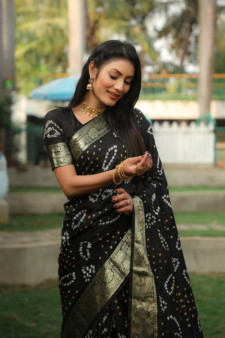 Bold red Bandhej silk saree with a lavish Bandhej pallu and jari weaving, perfect for special celebrations.