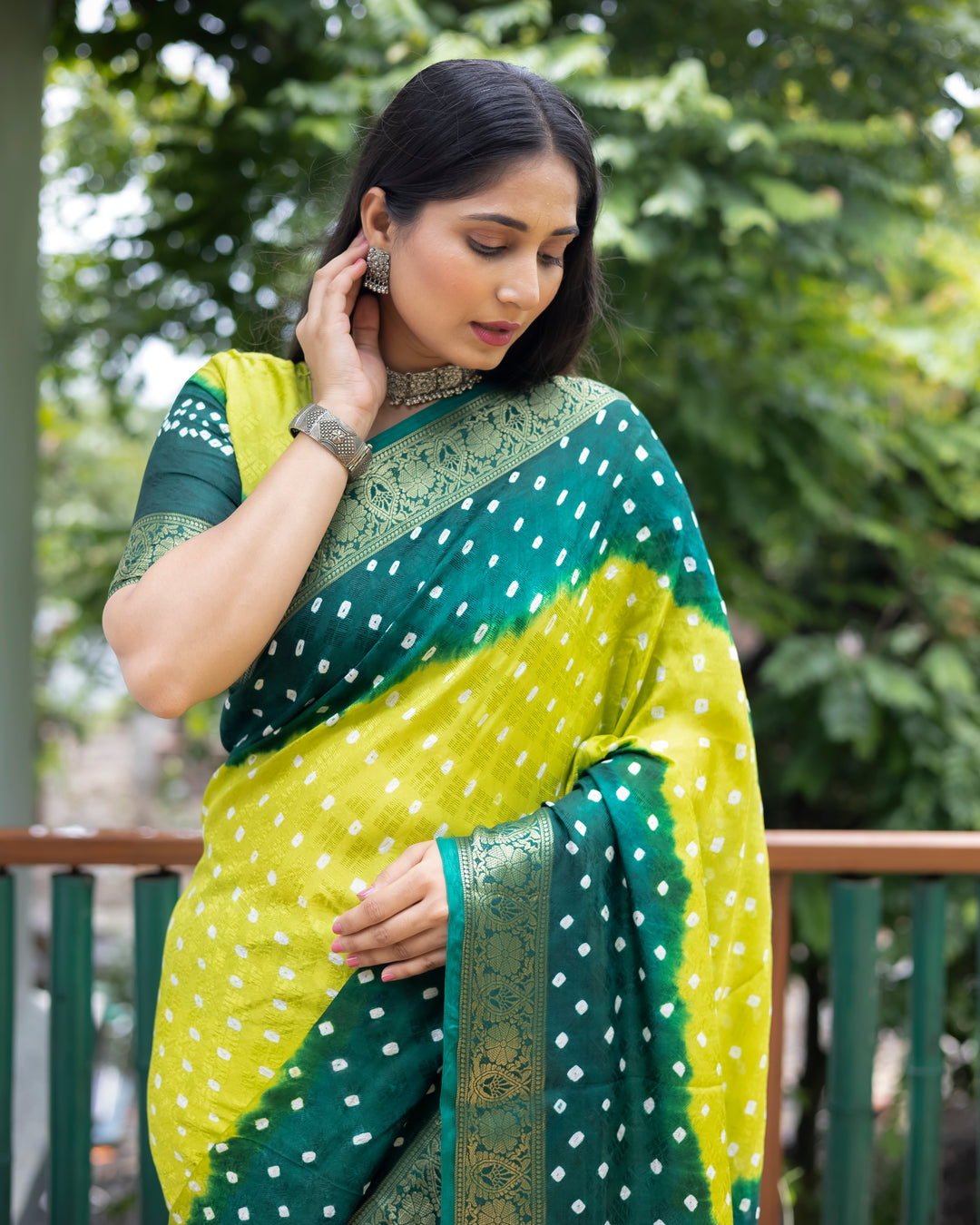 Graceful pink Bandhej silk saree with exquisite zari detailing and matching blouse, perfect for special celebrations.