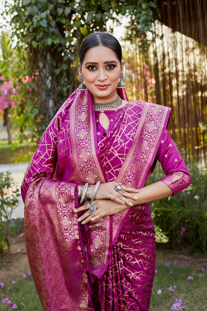 Stylish pink Kanjivaram soft satin silk saree with delicate butta design, perfect for weddings and festive occasions.