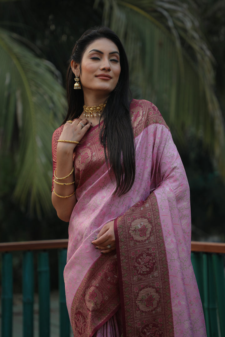 Soft lavender Kanjivaram silk saree featuring beautiful borders and fine craftsmanship, designed for elegant occasions.