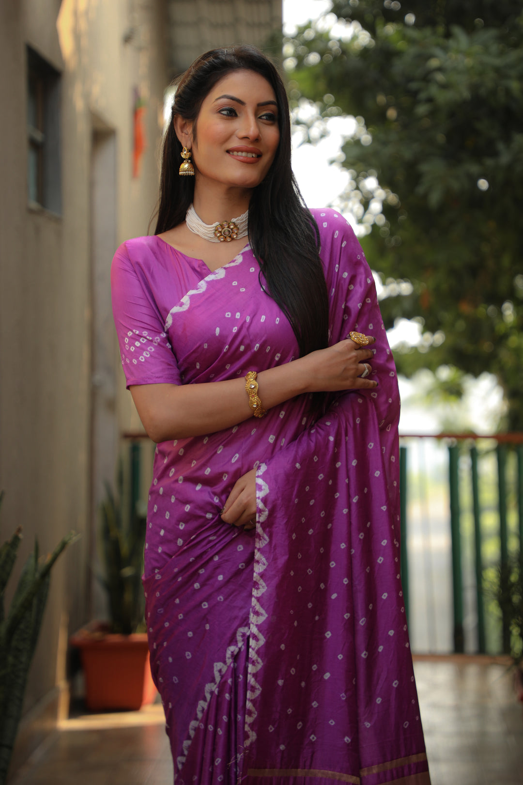 Stunning purple Bandhej silk saree with intricate checks design and luxurious feel.