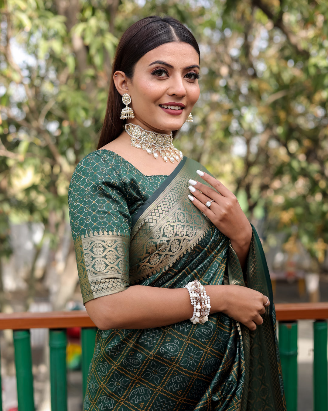 A stunning green Pure Handloom Bandhej Patola Silk Saree featuring intricate designs and a luxurious zari border, ideal for Indian weddings.