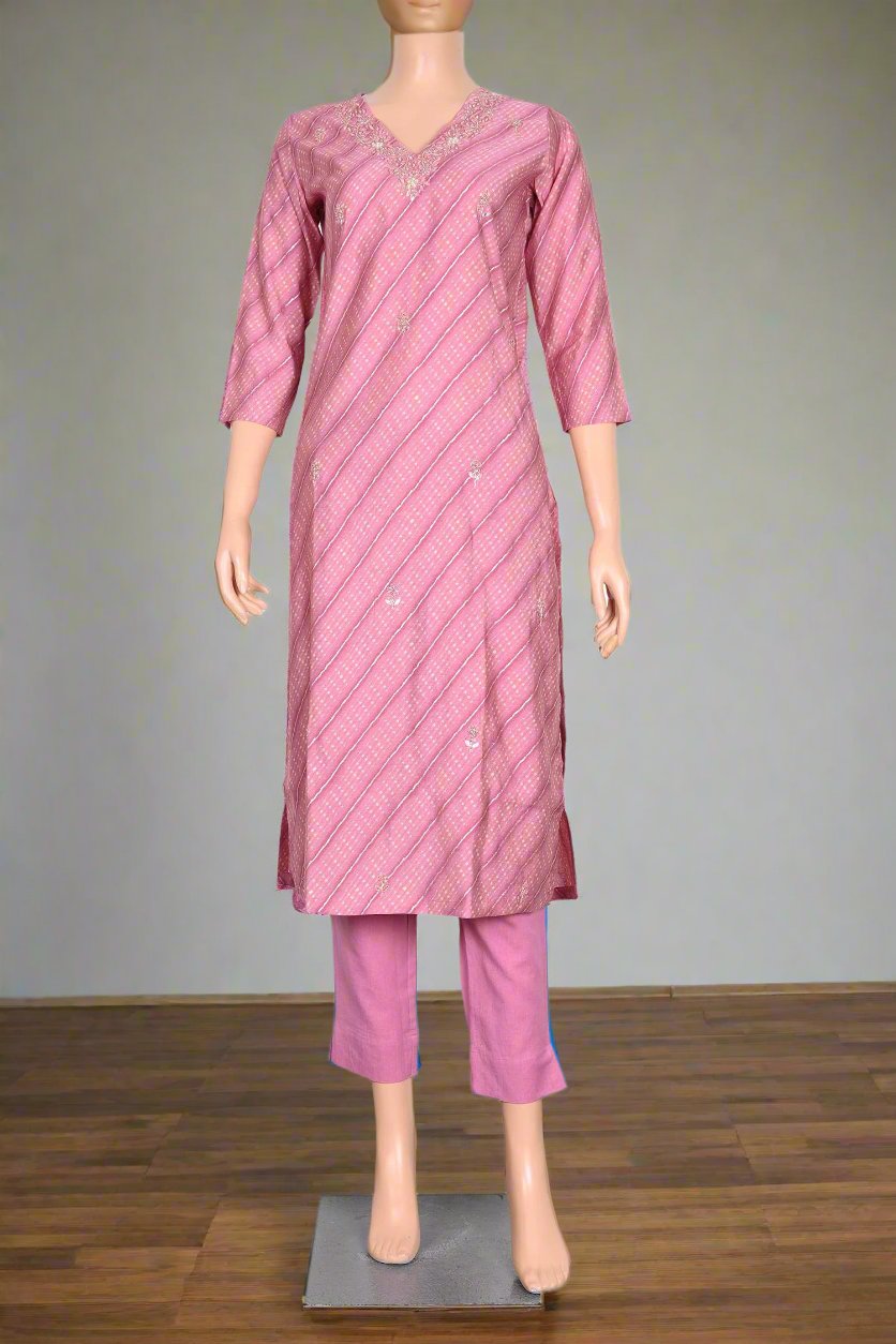 Light pink kurti set for women featuring an elegant muslin kurta adorned with sequins, perfect for stylish everyday wear