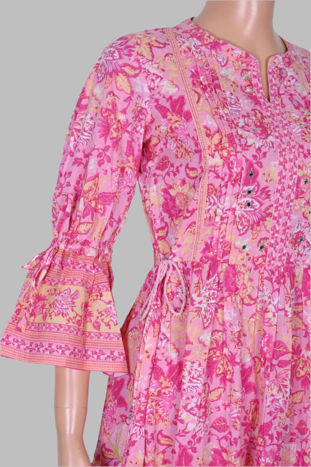 Trendy pink floral kurti designed for women, showcasing a beautiful print that balances comfort and elegance for daily wear