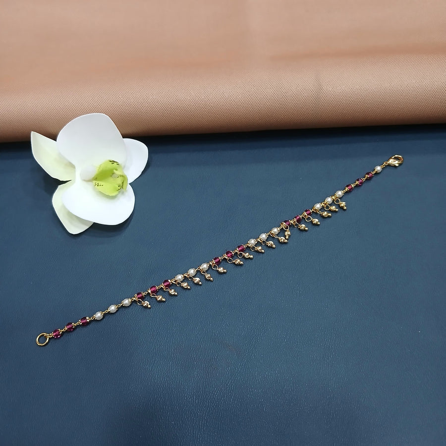 Charming golden bracelet with a floral pattern, perfect for vintage looks.