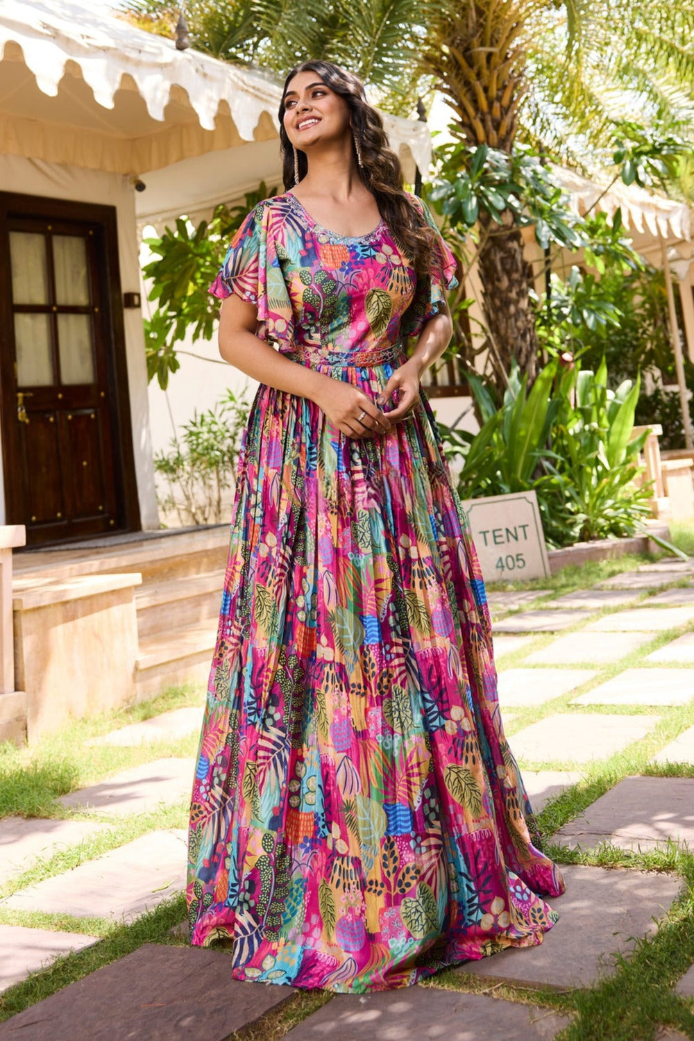 Stylish multicolor gown made from chinon fabric, showcasing pleats and a front slit for a chic look at celebrations.