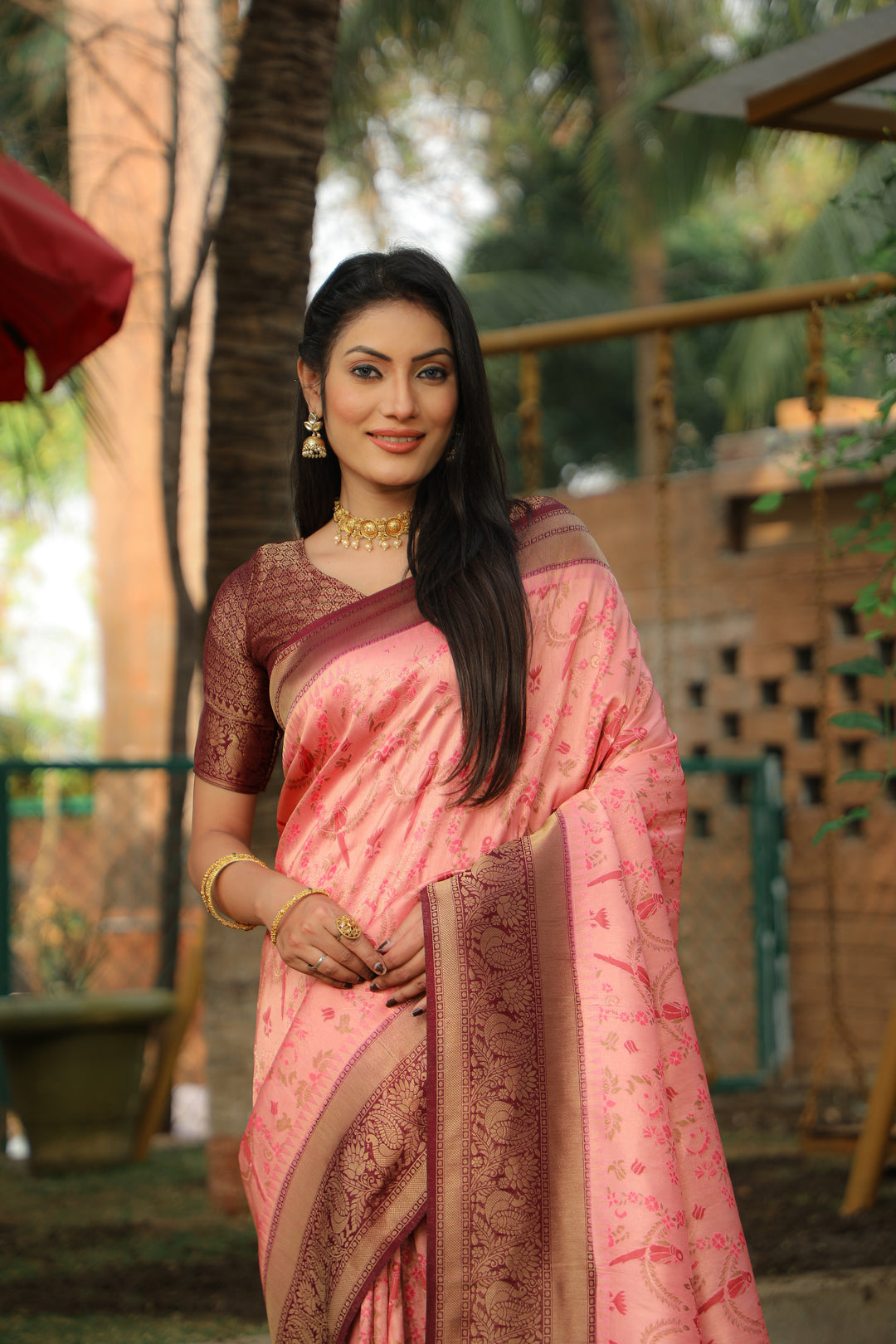 Pink Designer saree with Kanjivaram silk work and borders, perfect for Indian weddings and cultural celebrations.