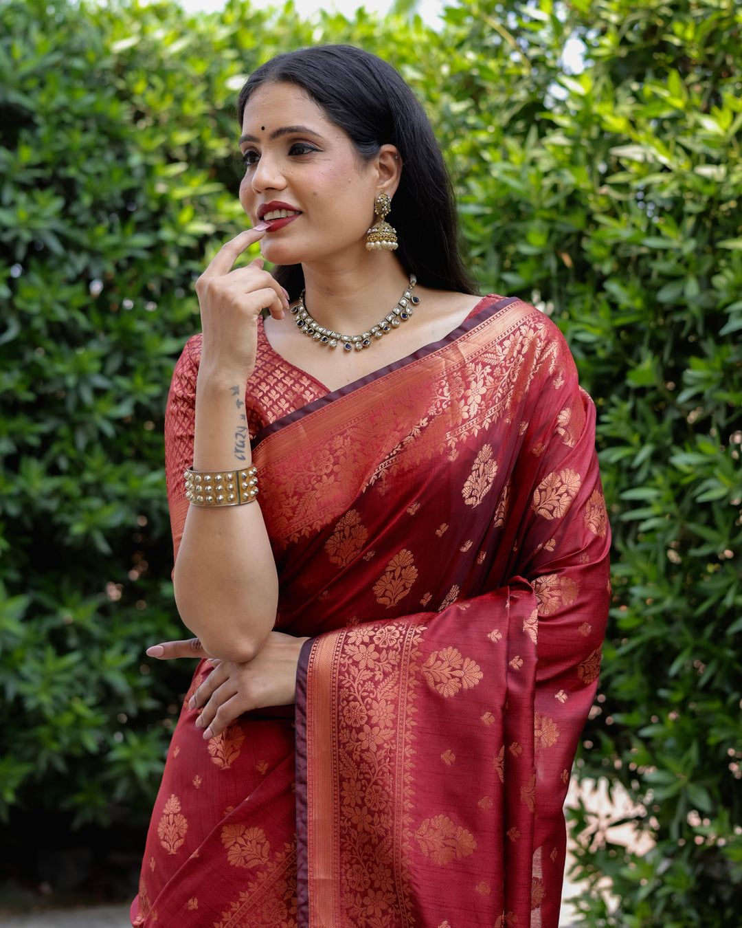 Stunning maroon soft silk saree with copper body and contrast woven borders, a perfect blend of tradition and elegance.