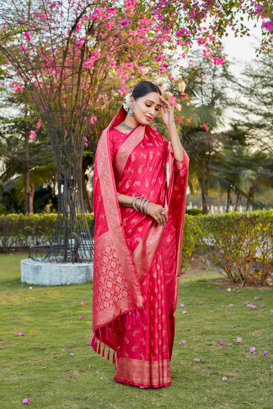 Graceful red satin silk Kanjivaram saree featuring butta work and woven pallu, perfect for cultural occasions.