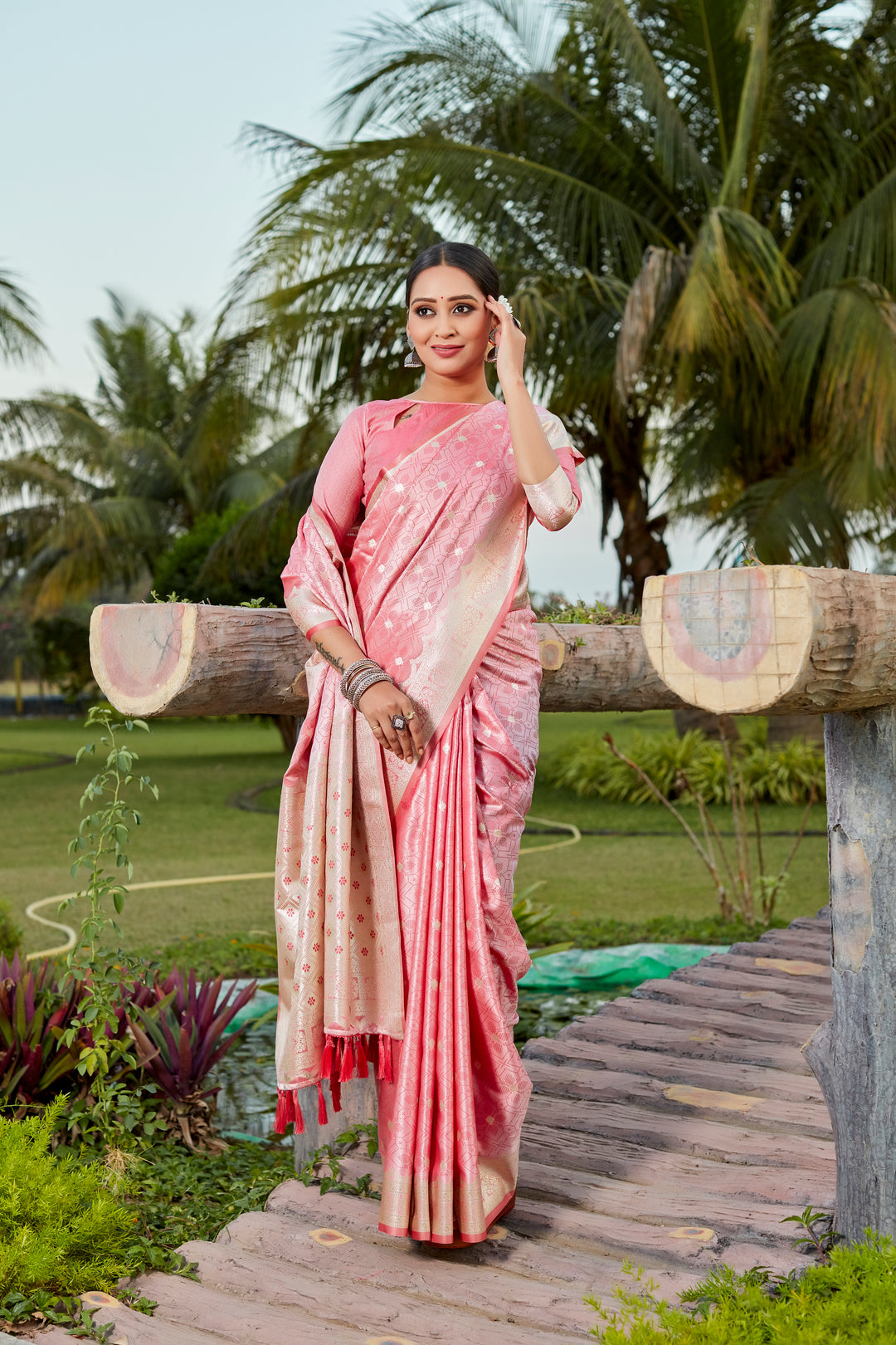 Vibrant purple Kanjivaram silk saree with intricate butta work and designer border, perfect for wedding occasions.