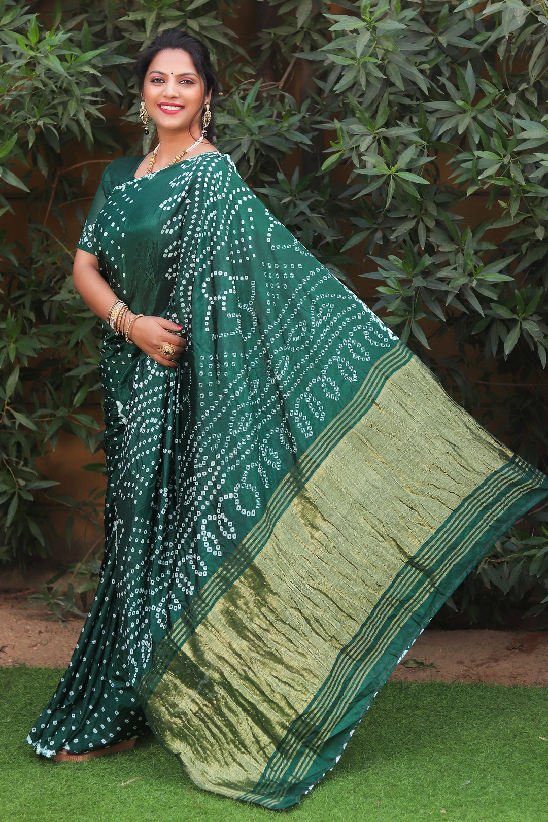 Teal green Bandhej saree in premium silk with Lagdi Patta, a beautiful choice for elegant occasions.