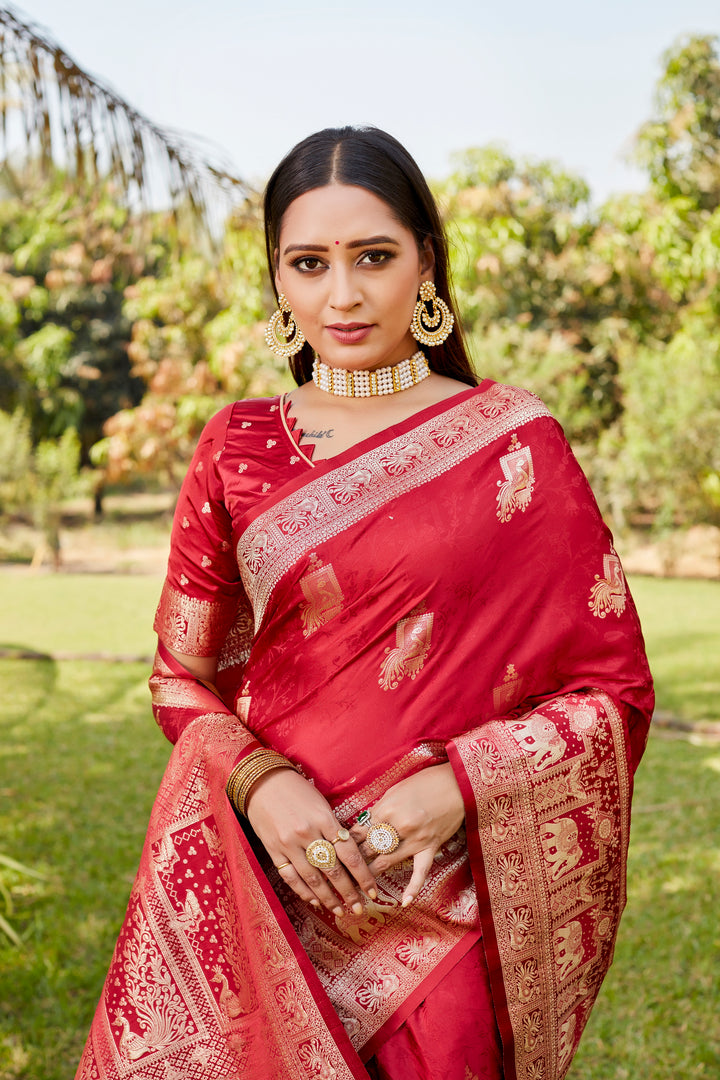 Gorgeous red satin Kanjivaram saree with traditional elephant border, perfect for weddings and cultural gatherings.