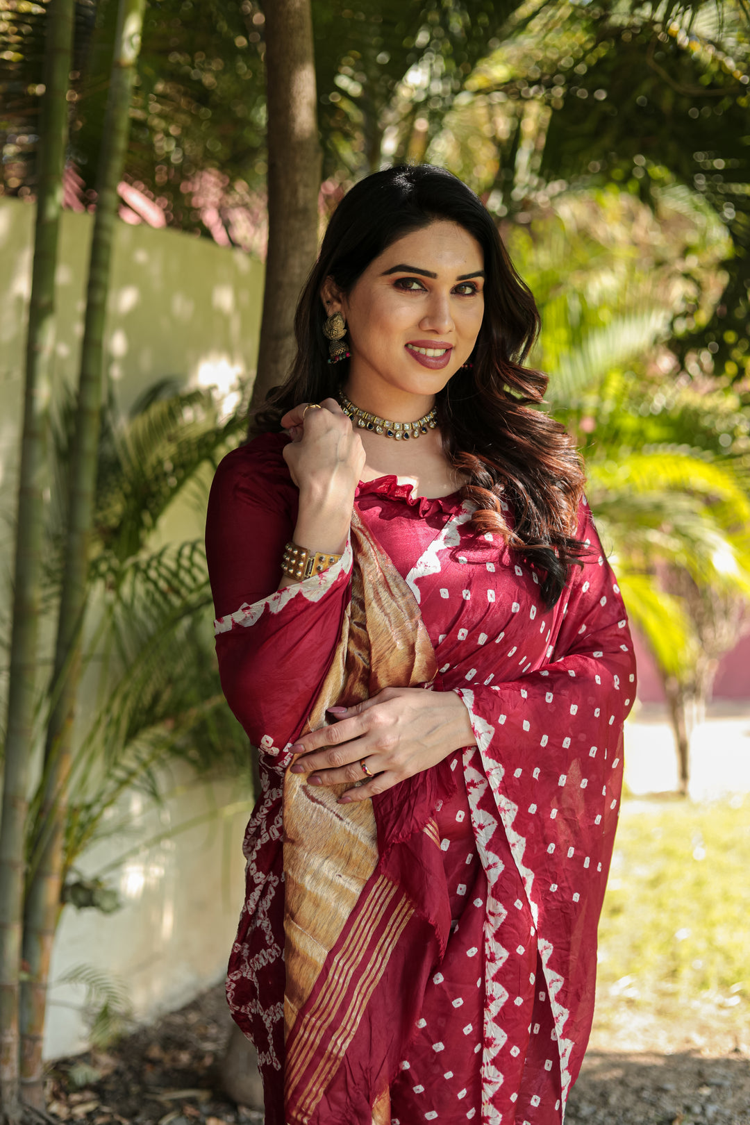 Elegant Maroon Bandhej Silk Saree with intricate Zari weaving and Pallu, perfect for traditional wear.