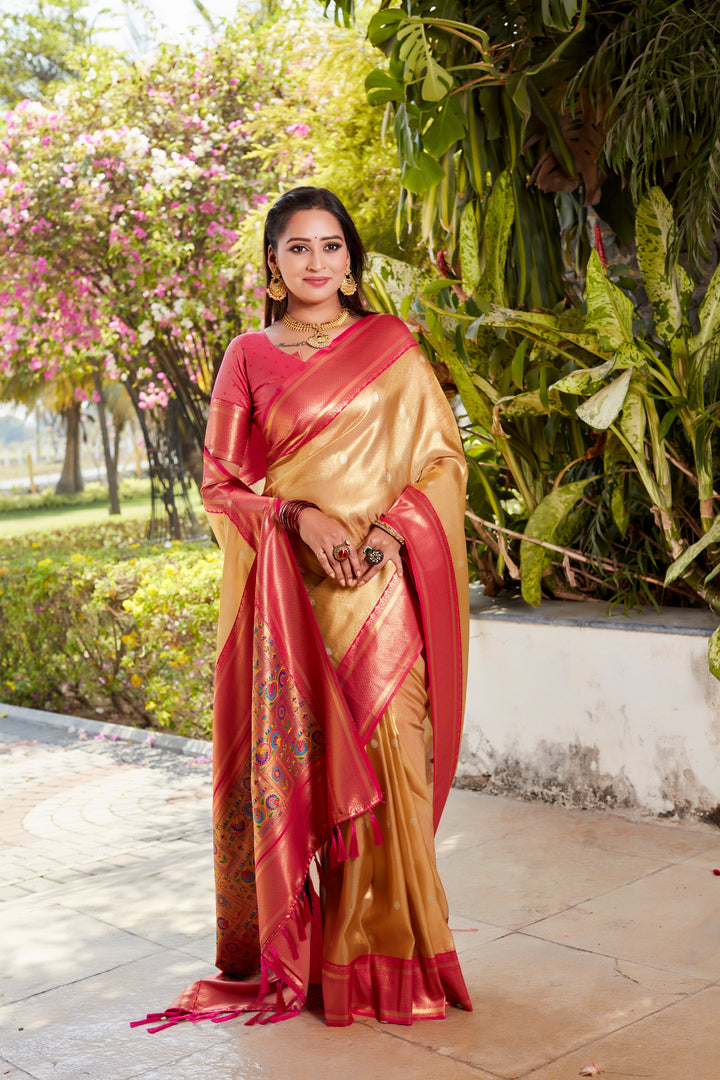 Traditional beige tissue silk saree with rich pallu and contrasting blouse, perfect for weddings and cultural events.