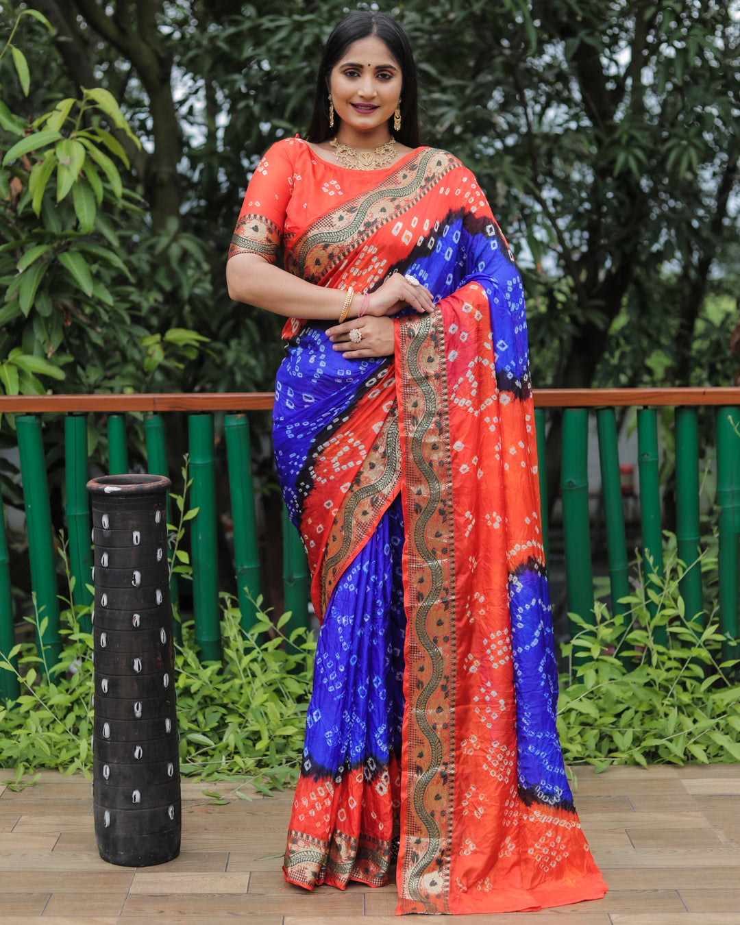 Elegant royal-blue Bandhej Tapeta silk saree with beautiful dual-color effect, ideal for weddings and celebrations.