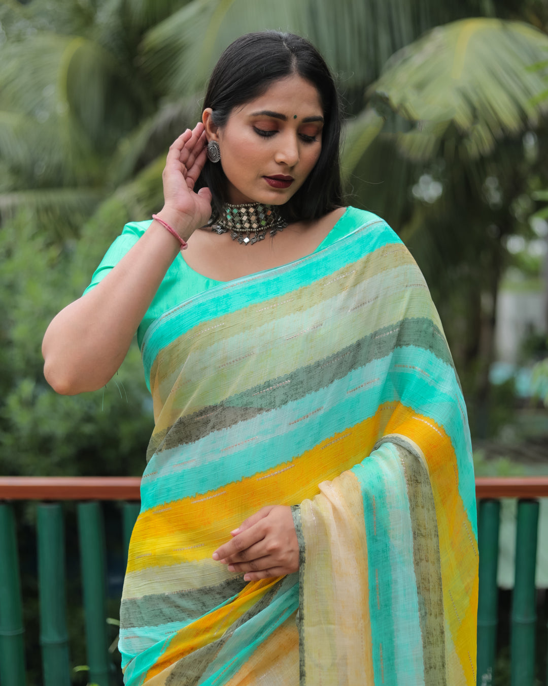 Radiate elegance in this deep mint Moss chiffon saree with a luxurious gold foil design, perfect for adding glamour to your special occasions.