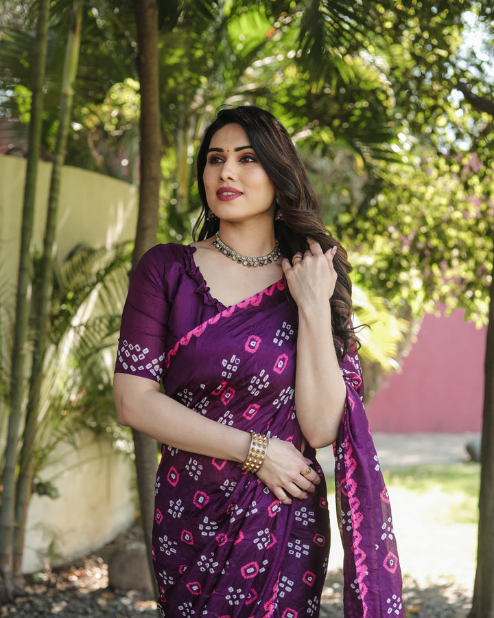 Royal Bandhej silk saree with detailed zari weaving and luxurious tissue pallu.