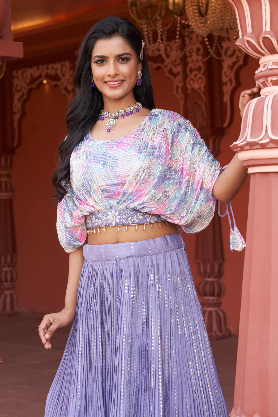 Chic purple lehenga set showcasing floral designs in chinon fabric, perfect for making a statement at events.