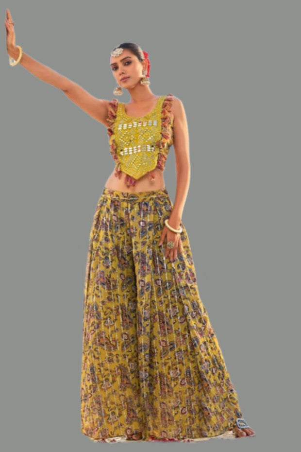 Yellow georgette palazzo set with shimmering pants, perfect for festive gatherings.