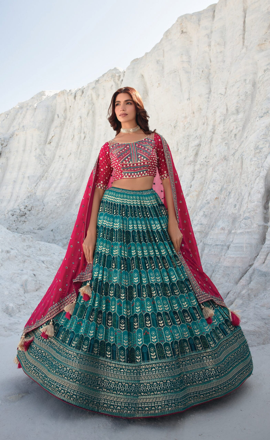 Elegant pink and blue bridal lehenga set with embroidered blouse and dupatta, perfect for a stunning wedding look.