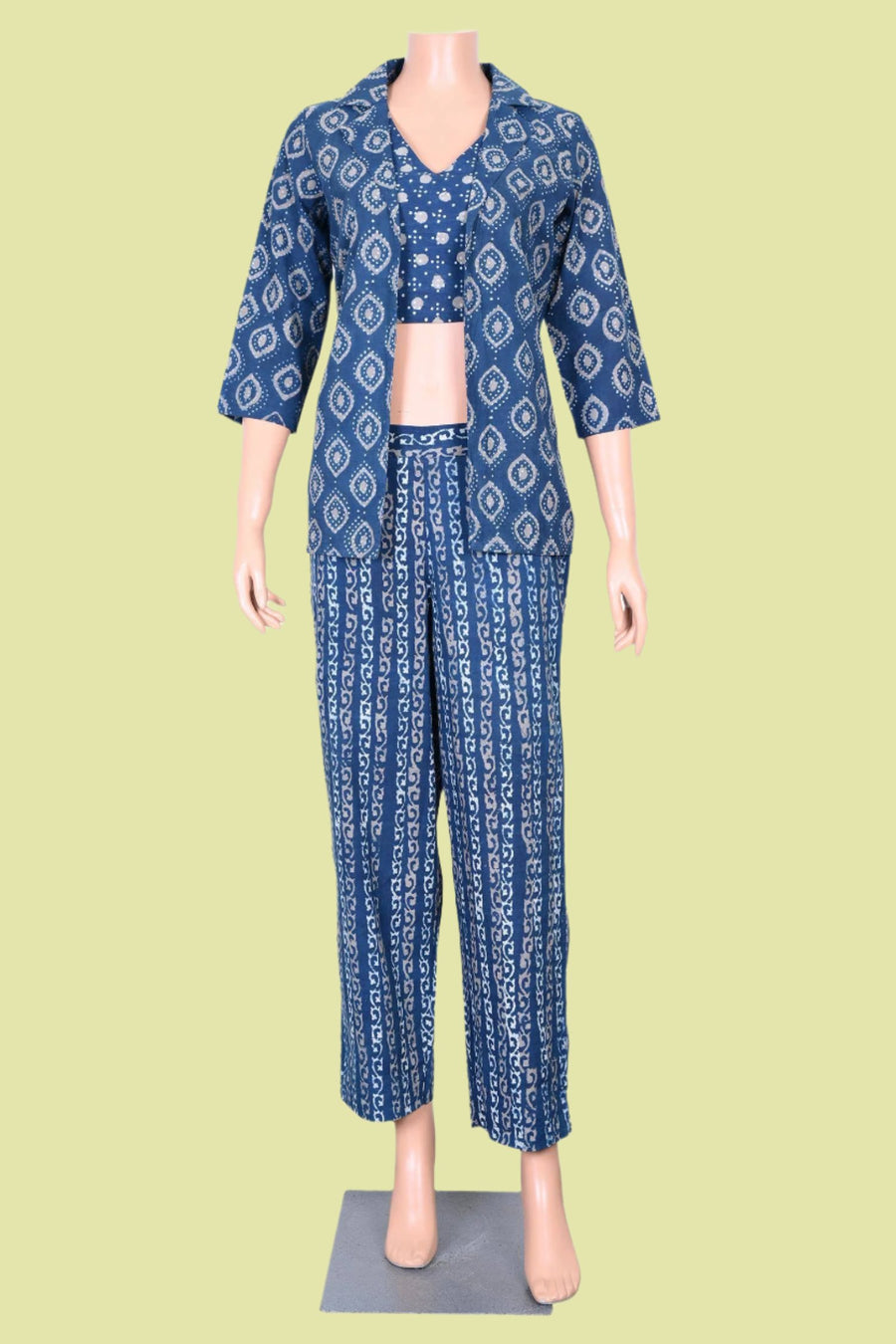 Trendy indigo co-Ord set featuring a hand block printed double collar coat, sleeveless blouse, and stylish pants.