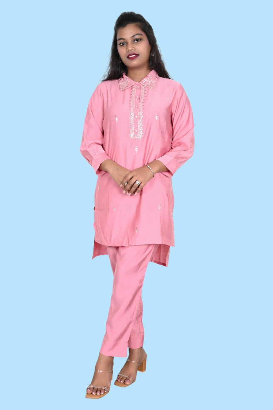 Trendy peach Kurti set featuring intricate gold accents, ideal for stylish women’s ethnic wear.