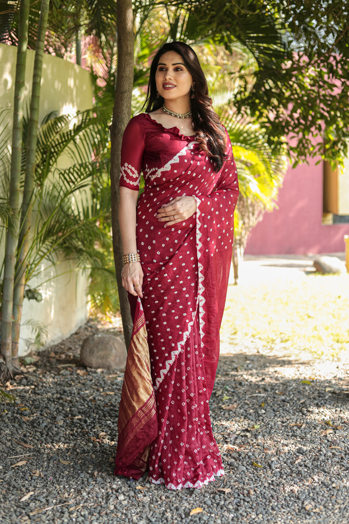 Premium Maroon Bandhej Silk Saree featuring beautiful Zari weaving and original design with Pallu.