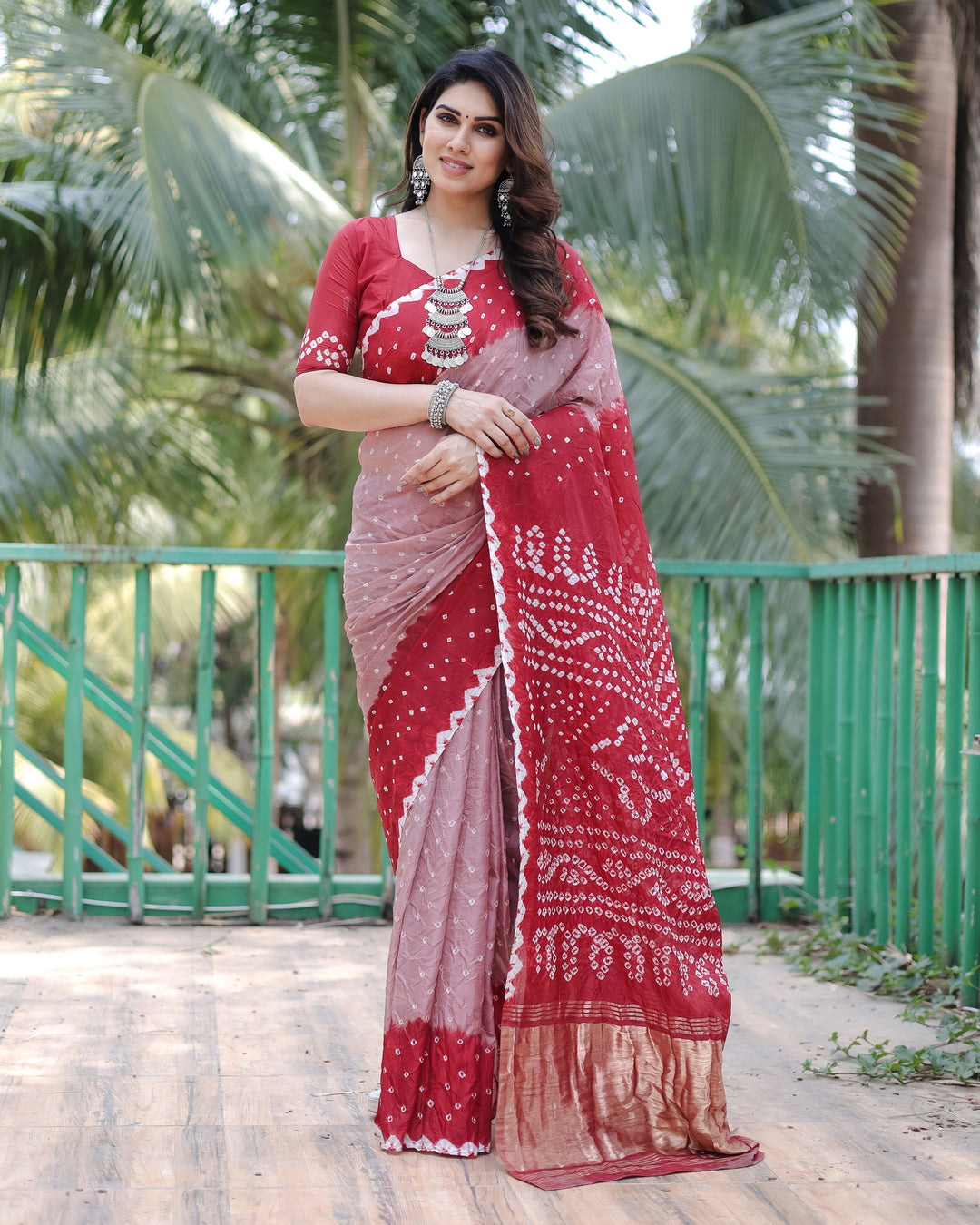 Elegant Red Bandhej Silk Drapes with Zari Tissue Pallu and blouse piece, ideal for weddings or parties.