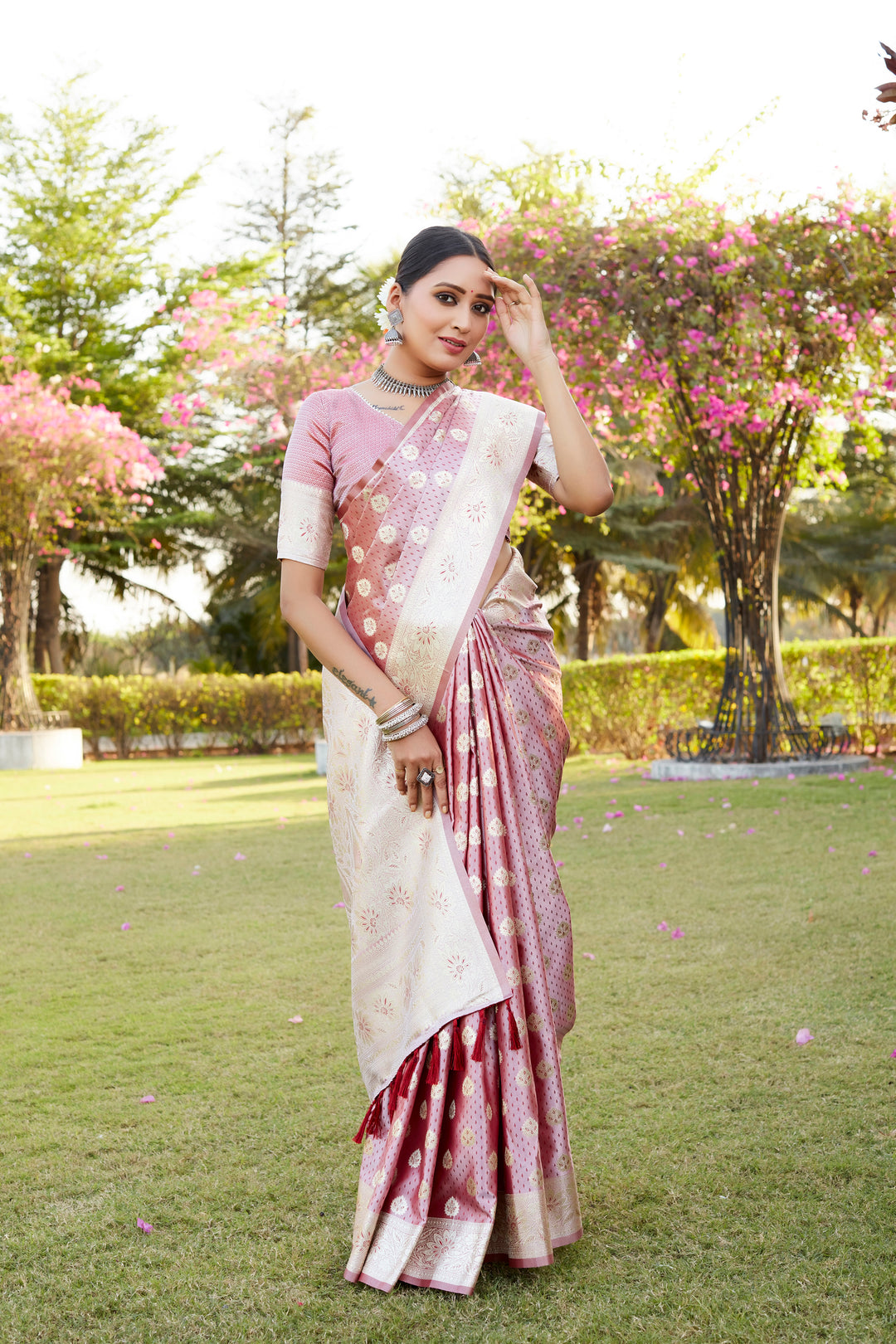 Sophisticated pink Kanjivaram Soft Satin Silk saree, featuring detailed weaving butta work and a designer satin border.