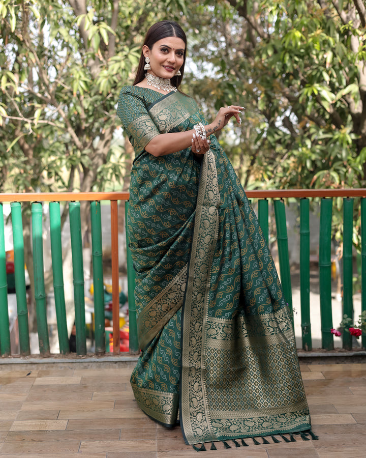 Elegant green Bandhej Patola silk saree with intricate zari work and Kanchi borders, perfect for cultural events.