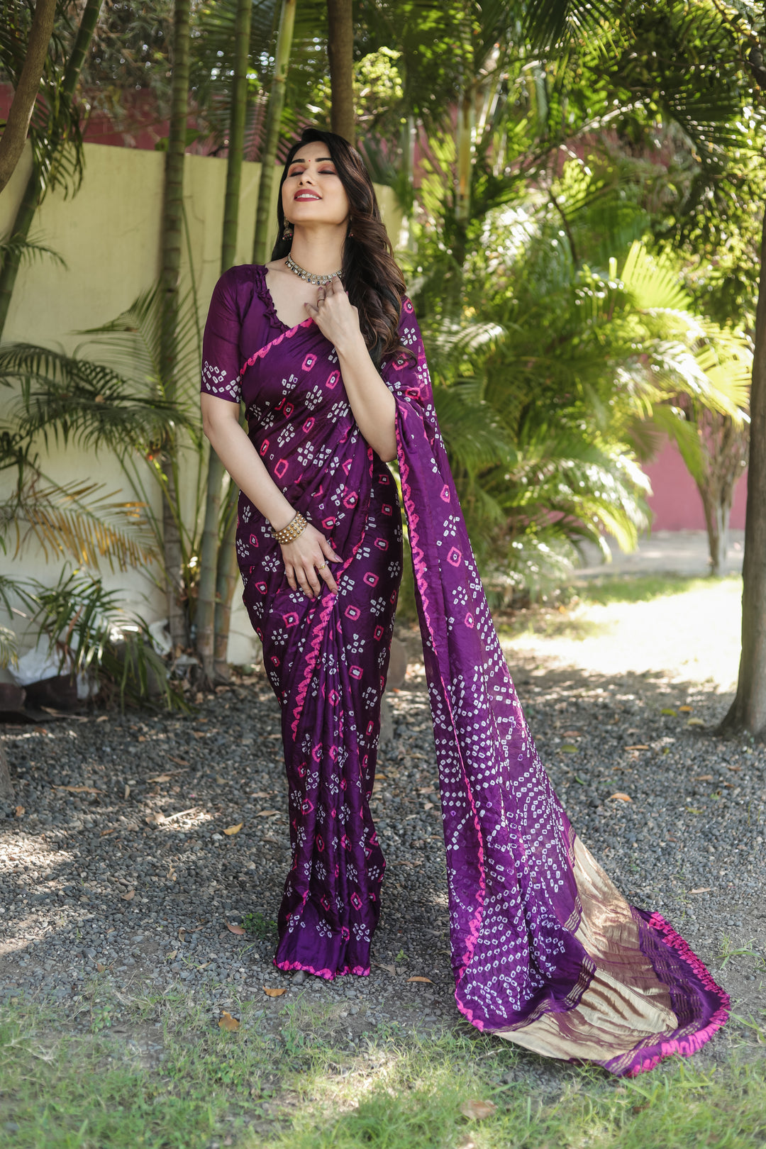 Elegant Bandhej silk saree with tissue pallu and stunning zari weaving for festive occasions.